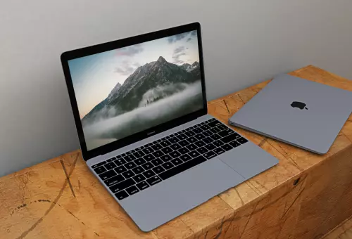 MacBook on a wooden surface